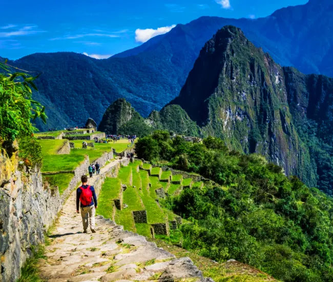 Short Inca Trail to Machu Picchu Scenic View | Conde Travel Adventures Panoramic view from the Short Inca Trail overlooking Machu Picchu in the Andes Mountains of Peru | Conde Travel Adventures